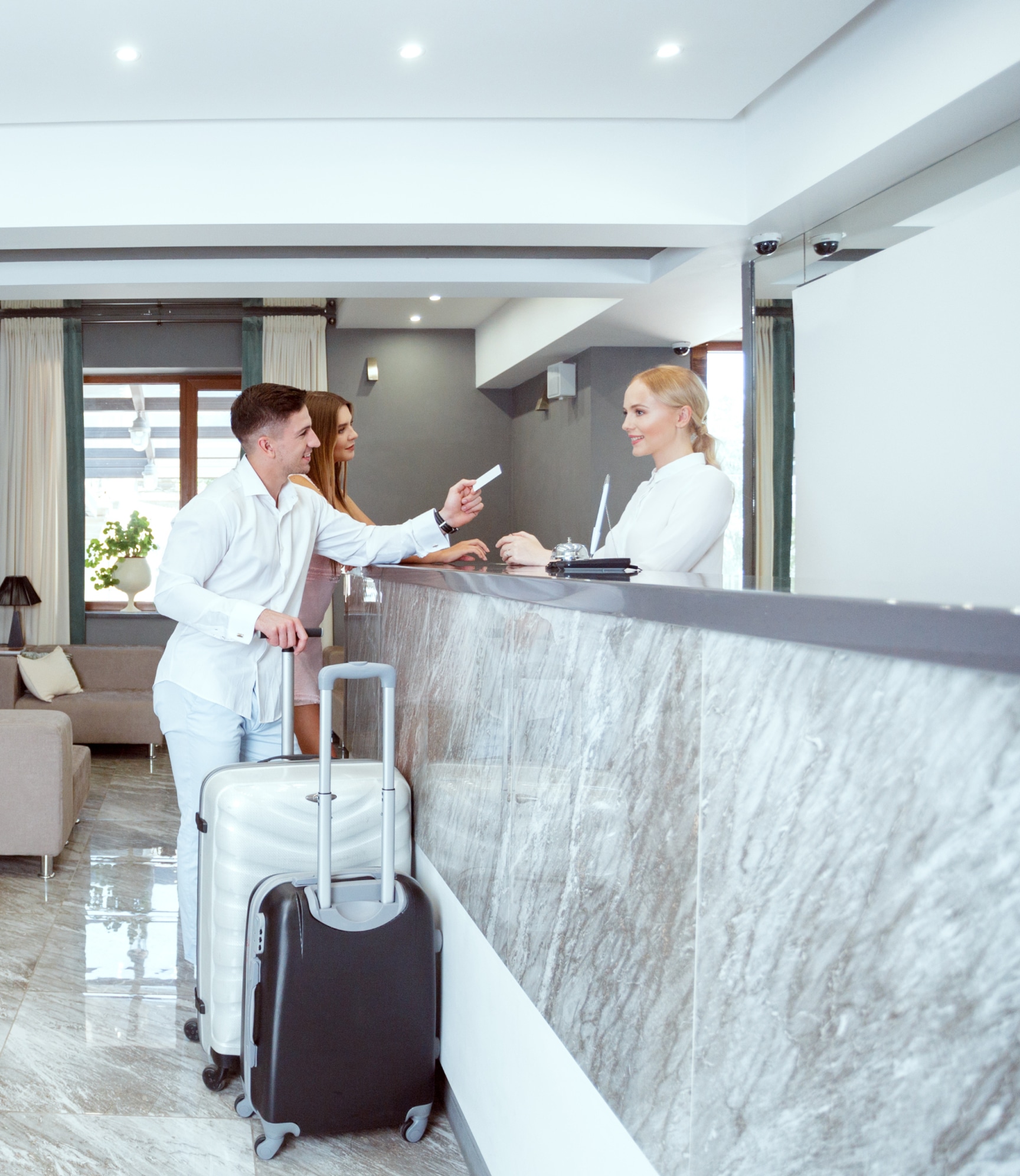 A couple checking in to a hotel