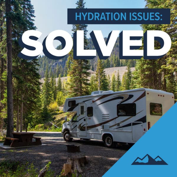 The text, 'Hydration Issues: Solved' over an photo of an RV in a wooded camping space