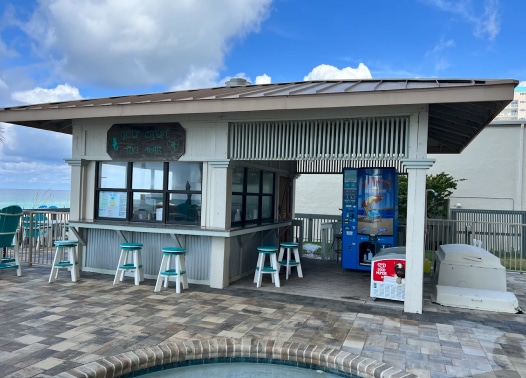 An Everest Ice Machine near a bar and pool